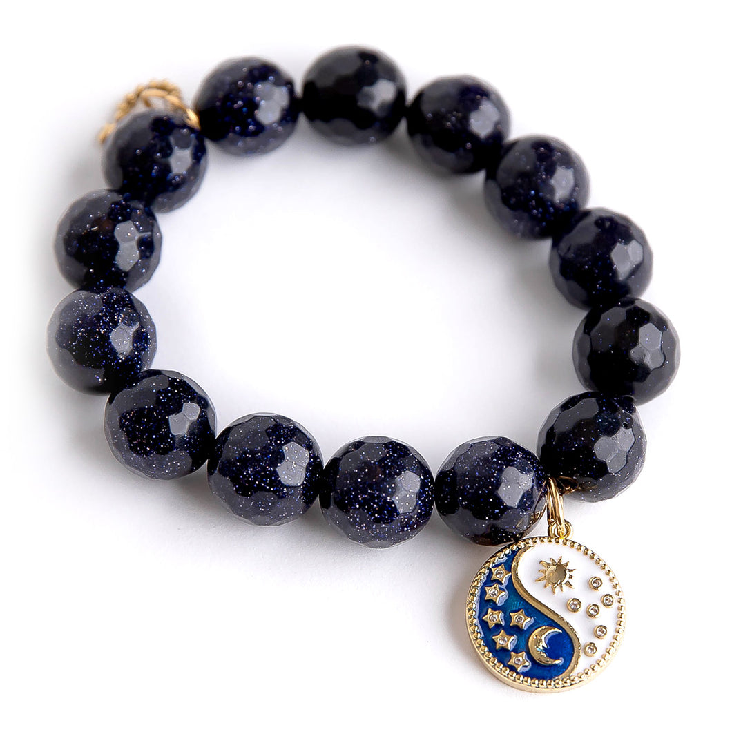 Faceted Navy Goldstone paired with an enameled Sun & Moon medal