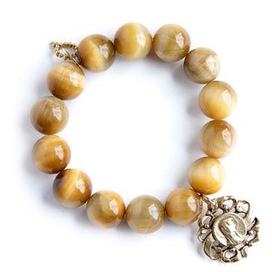 Sunkissed Tiger Eye paired with a brass Frilly Blessed Mother