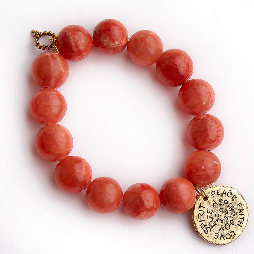 Terra cotta agate paired with a brass spirit medal