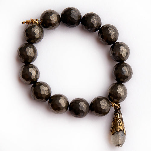 Faceted matte pyrite paired with a gemstone droplet