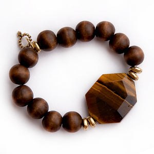 Rosewood paired with tiger eye statement slice and gold accents