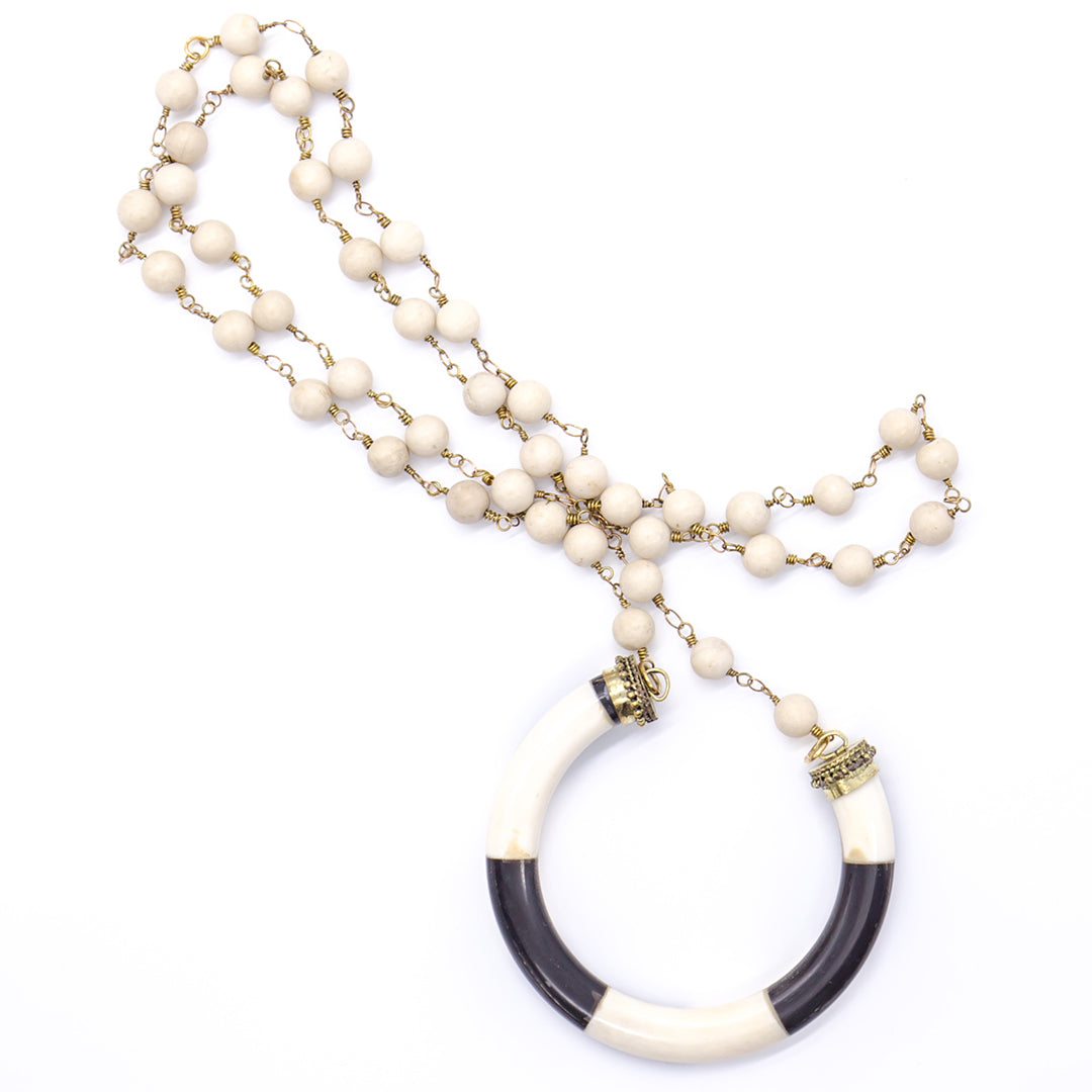 Cream coral with lucky horseshoe bone pendant