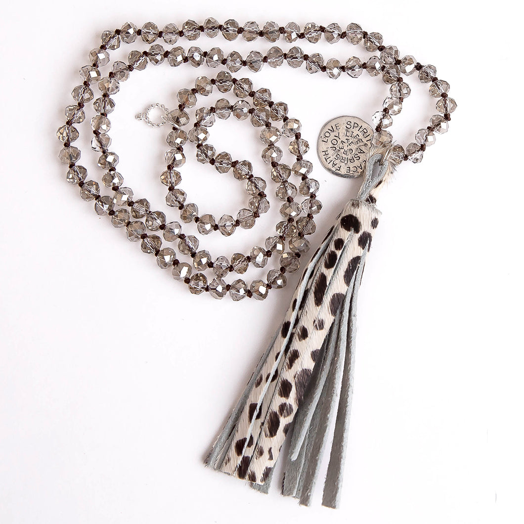 Faceted Light Grey Quartz hand tied gemstone necklace paired with a Dalmatian animal print leather tassel & spirit disc