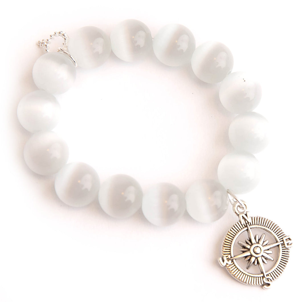 White calcite paired with a silver compass medal