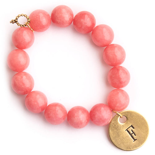Faceted watermelon agate paired with a brass hand stamped initial medal