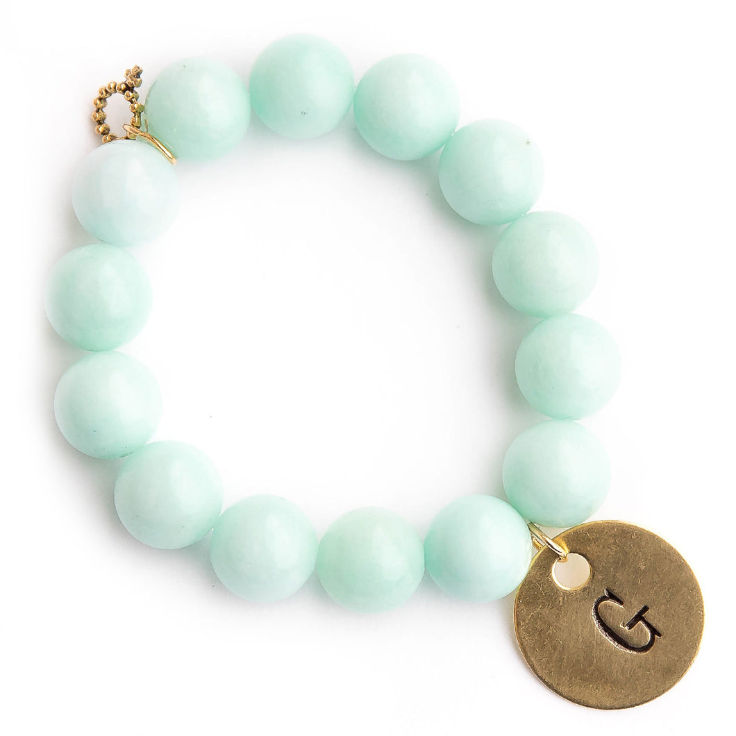 Aqua jade paired with a brass hand stamped initial medal