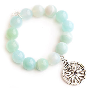 Caribbean agate paired with silver fleur di lis compass