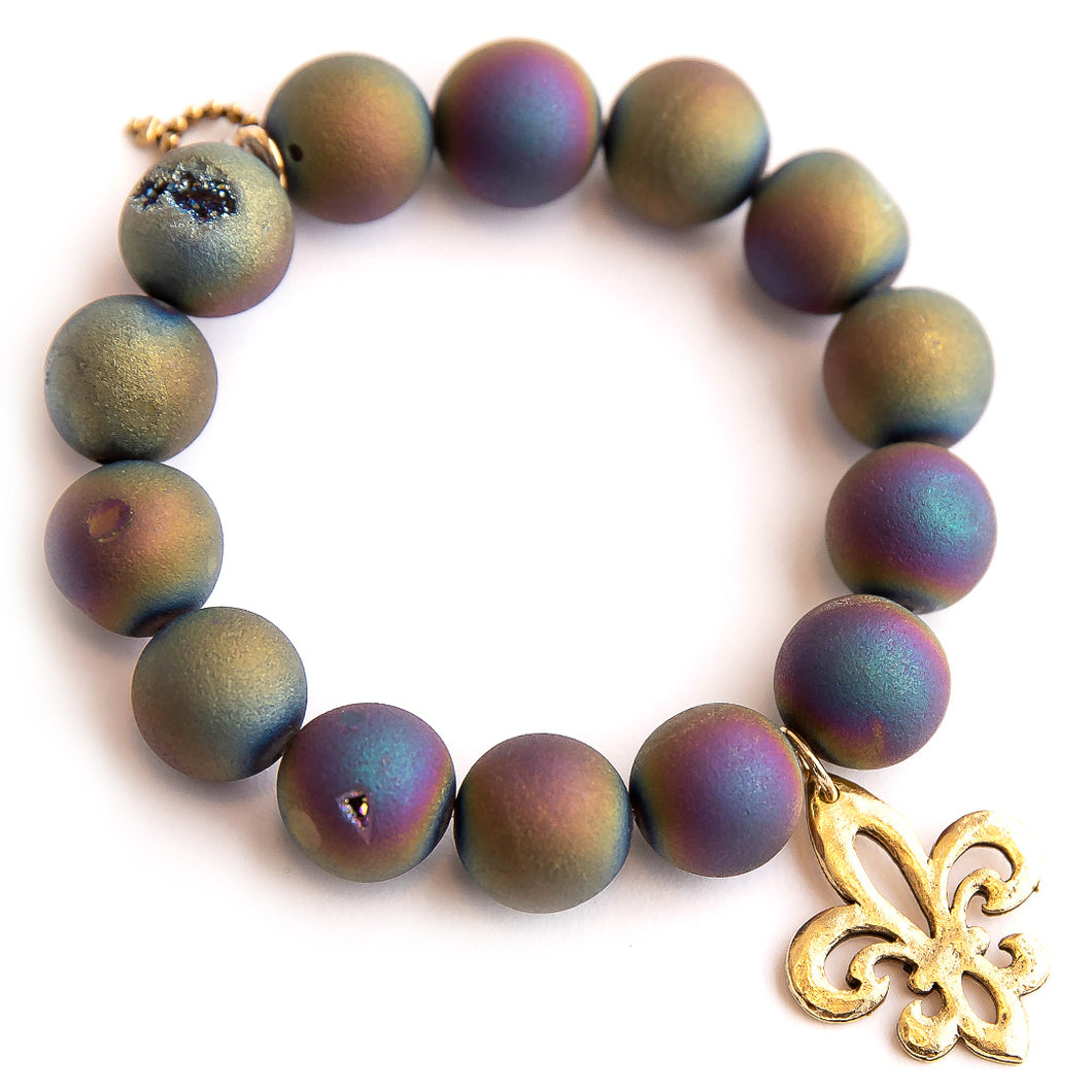 Matte iridescent druzy agate paired with a brass fleur di lis