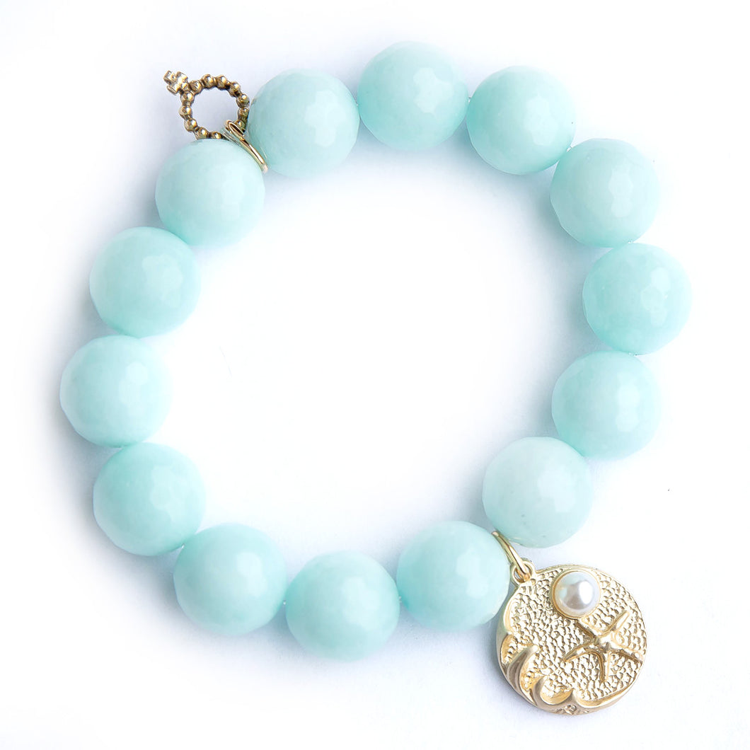 Aqua jade paired with a brushed bronze jewel of the sea medal