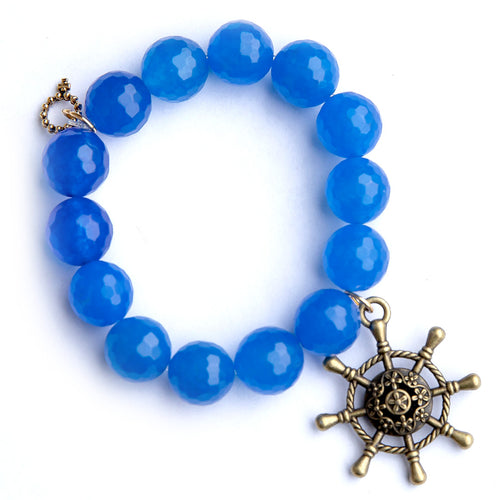 Royal marine agate paired with a bronze ships wheel
