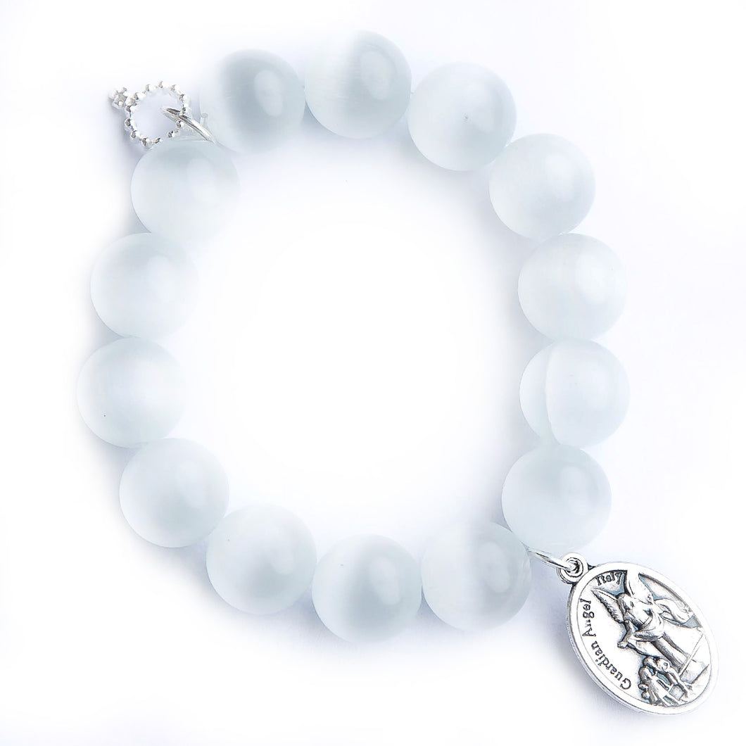 White calcite paired with an oval shaped guardian angel medal