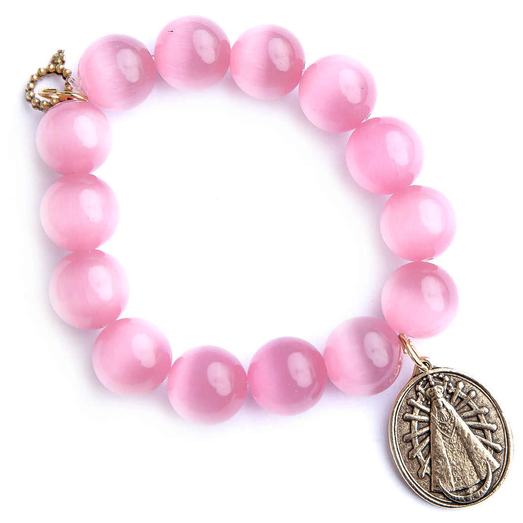 Blush Calcite paired with an Exclusively Cast Our Lady of Lujan medal.