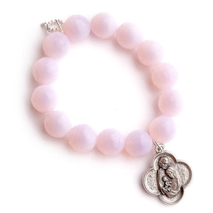 Faceted pink opalite paired with a scalloped Holy Family medal