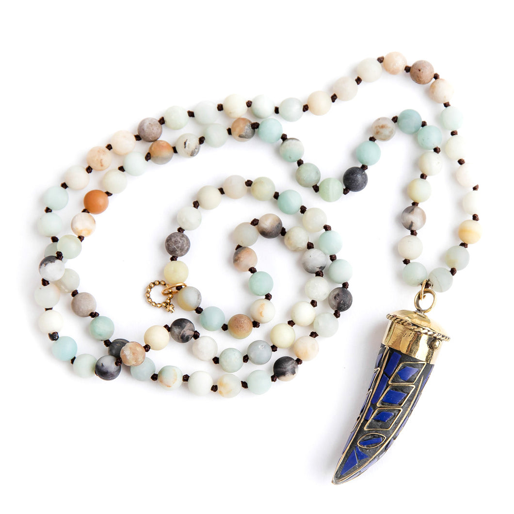 Hand tied matte amazonite gemstone necklace paired with a blue enameled horn of strength