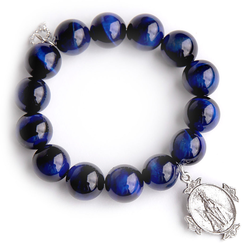 Midnight tiger eye paired with an exclusively cast silver Queen of Heaven medal