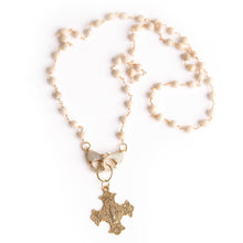 Cream coral convertible face mask necklace featuring an exclusively casted bronze Sacred Heart cross pendant