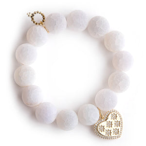 Matte white lace agate paired with a brass pave heart