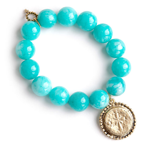 Bora Bora agate paired with a brushed gold bordered cross
