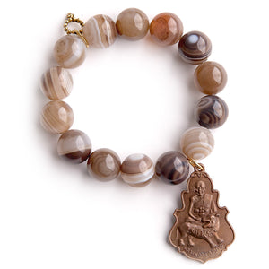 Brown swirl agate paired with a large bronze buddha medal