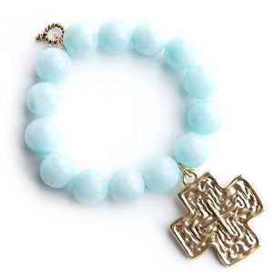 Aqua jade paired with a large brushed gold cross