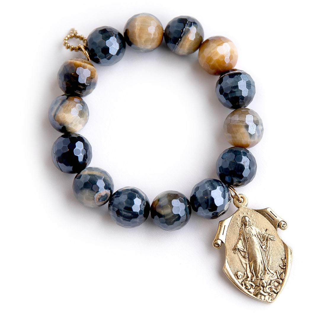 Faceted Caramel Latte Tiger Eye paired with an exclusively cast brass Queen of Heaven Shield