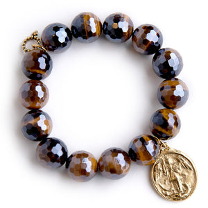 Faceted Iridescent Tiger Eye paired with a brass Saint Michael