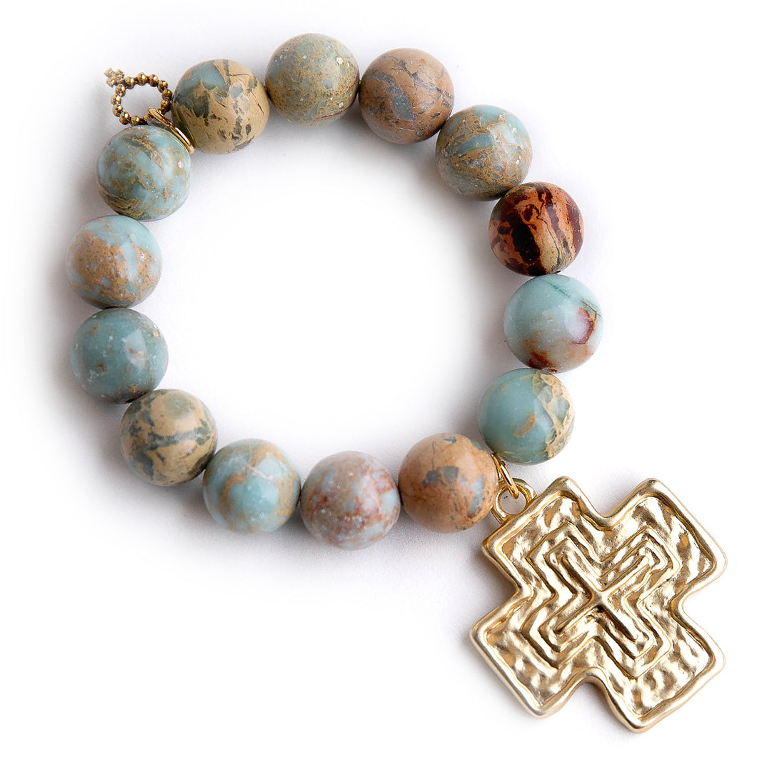 Aqua Terra Jasper paired with a large brushed bronze cross