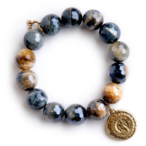 Faceted Caramel Latte Tiger Eye paired with a Saint Christopher Compass