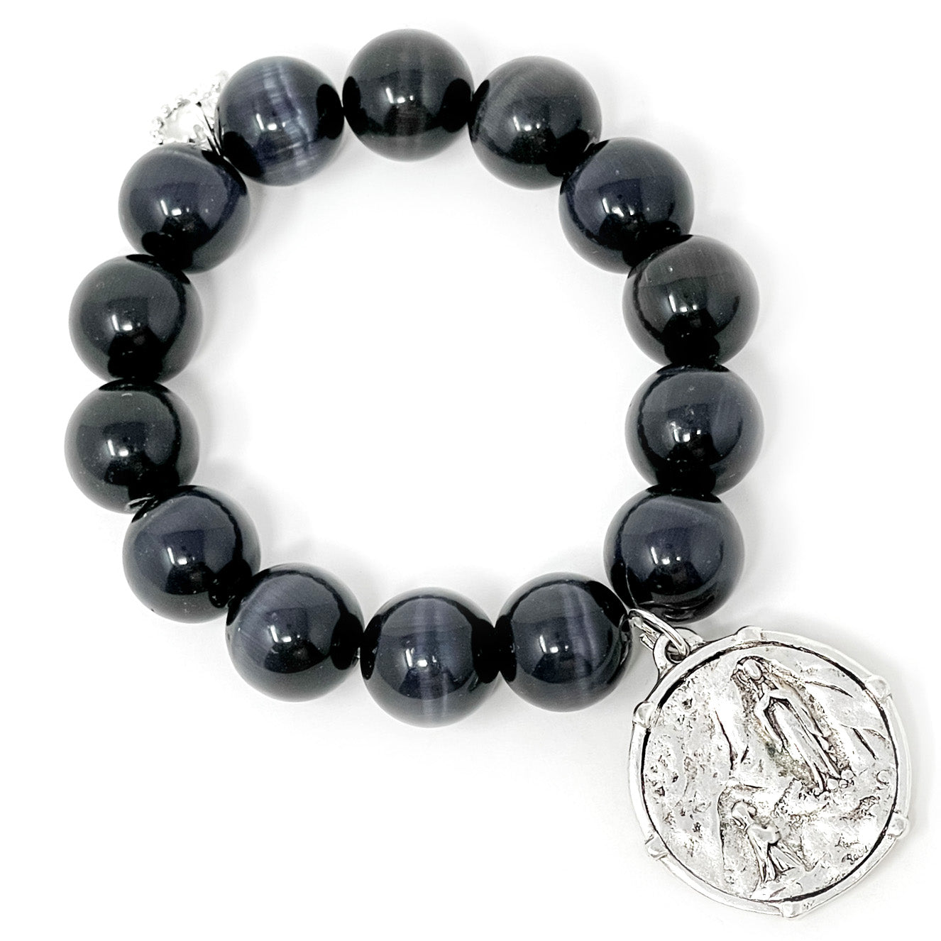 Black Pearl Calcite paired with a Private Collection Bezeled Lourdes Medal in
