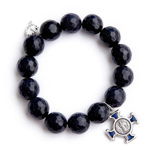Faceted navy goldstone paired with a blue enameled Saint Benedict cross