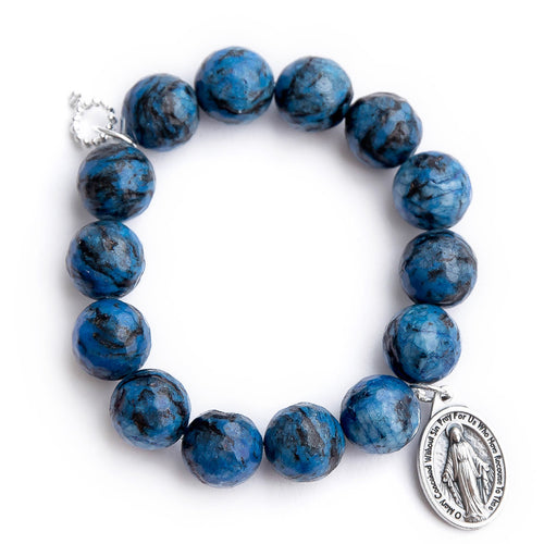 Faceted cayman agate paired with a silver oval Miraculous medal