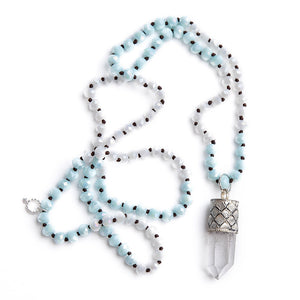 Hand tied faceted blue & white quartz gemstone necklace with silver capped raw crystal