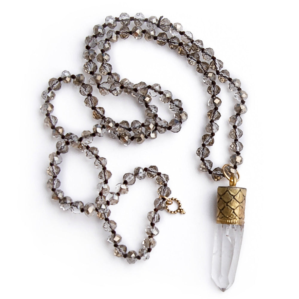Hand tied faceted light grey quartz hand tied gemstone necklace with gold capped raw crystal